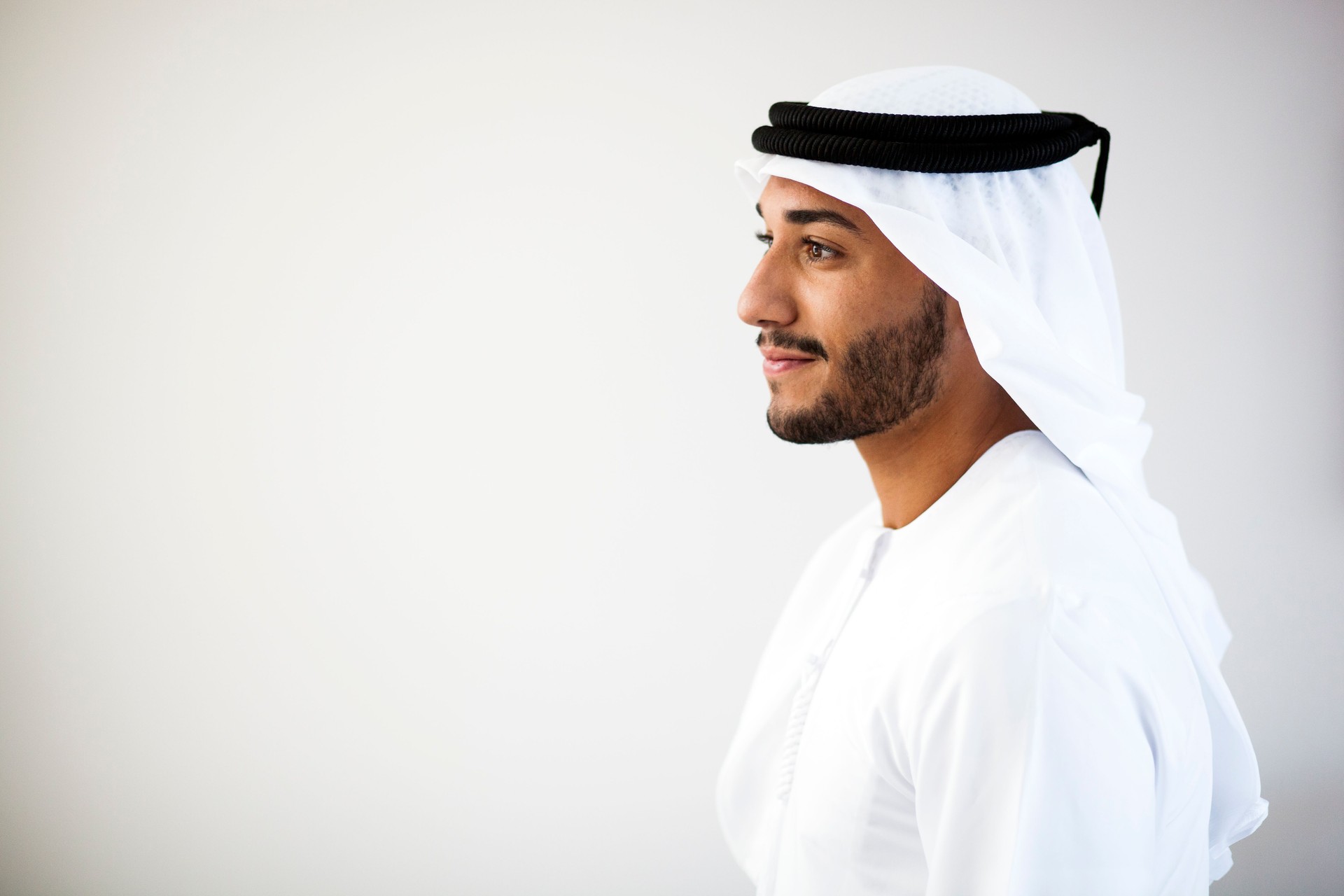 Portrait of a Middle Eastern man smiling to the left