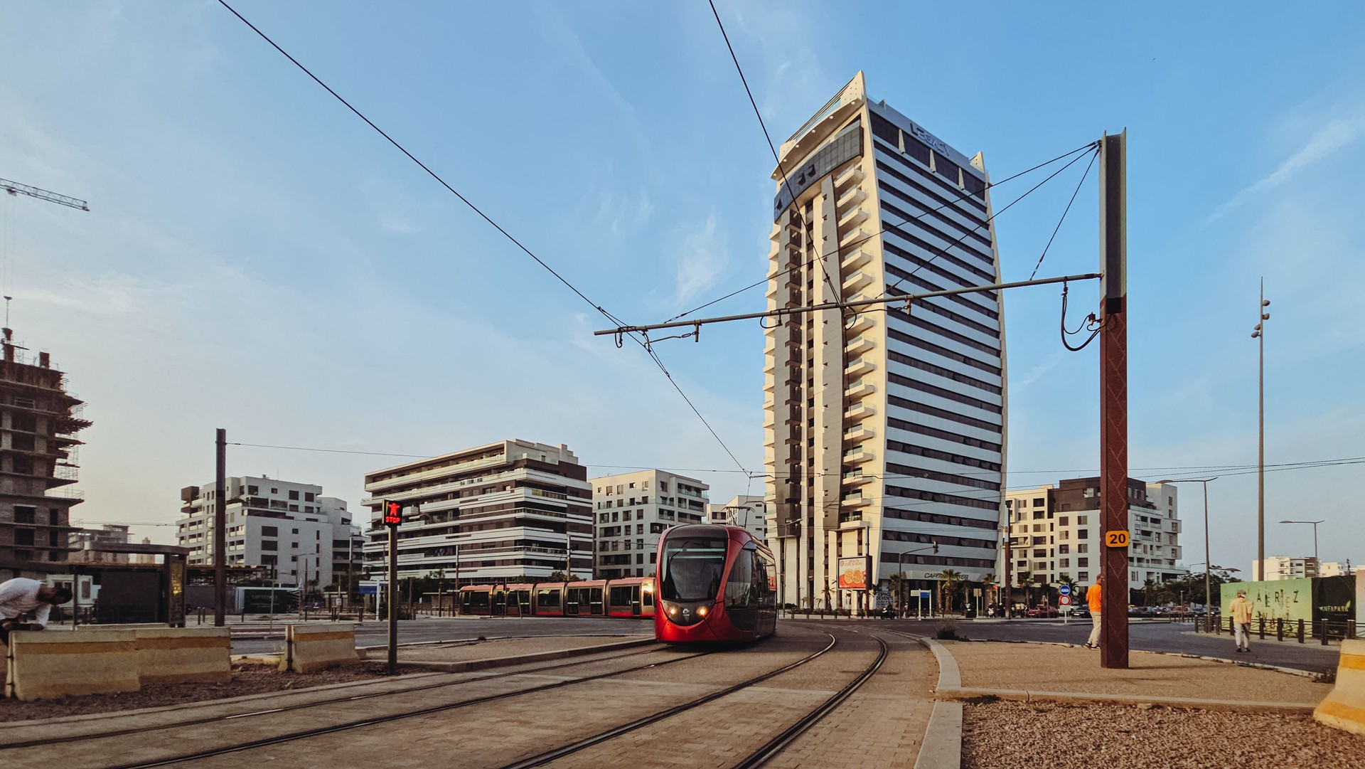 view of Casablanca tramway passing against  Capital Tower by Legacy Capital in the new Casa-Anfa zone the new finance district in Casablanca